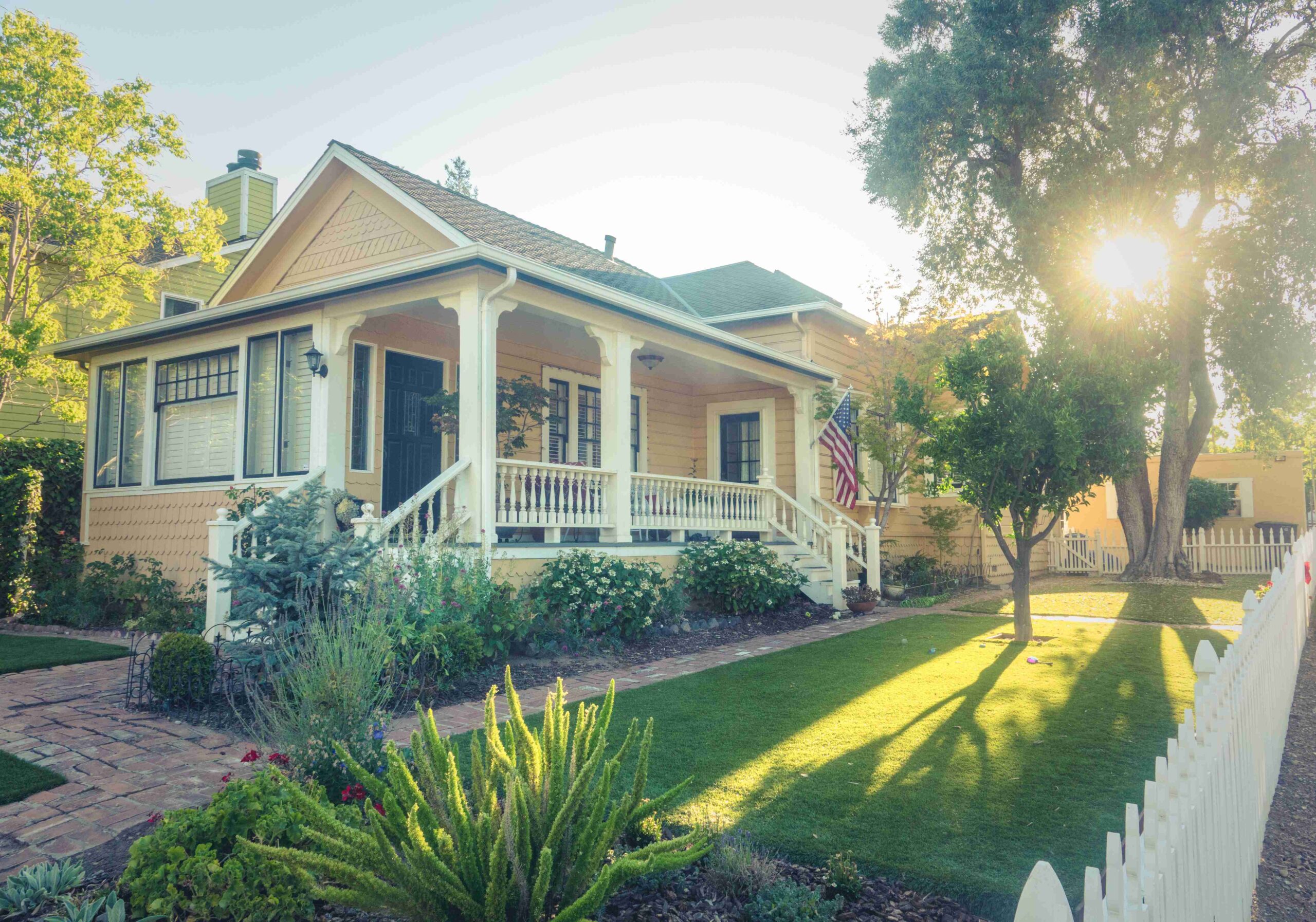 Older American home with yellow and white coloring